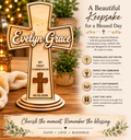 Wooden cross with engraved name and date on a wooden surface with decorative elements.